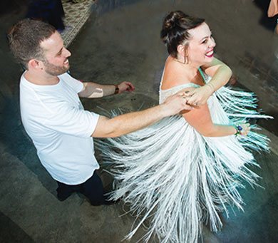 Haim and Ori celebrate at their wedding. Haim and Ori dance at their wedding.
