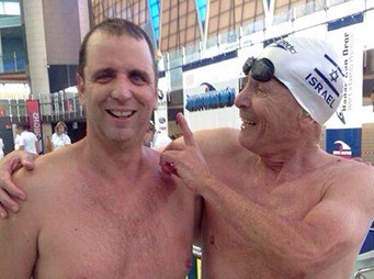 Ziv with a friend while working out at the pool.