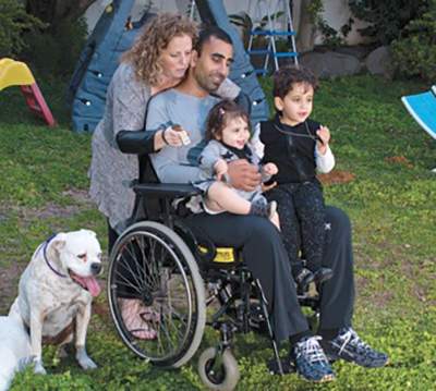 Disabled veteran and his family