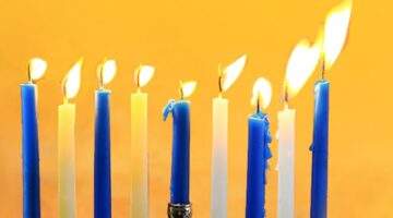 8 lit Hanukkah candles